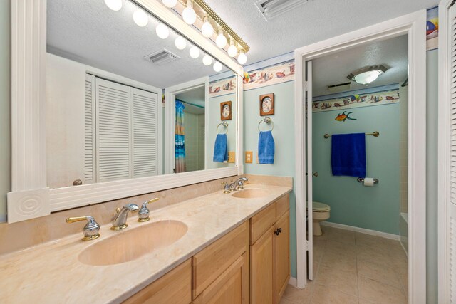 8520 Gulf Blvd # Ut-39, Navarre, FL 32566 - full bath featuring a textured ceiling, tile patterned flooring, toilet, double vanity, and a shower with shower curtain