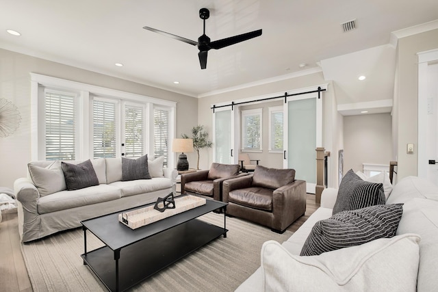 107 Grande Pointe Dr, Inlet Beach, FL 32461 - living area with light wood finished floors, a barn door, a ceiling fan, recessed lighting, and ornamental molding