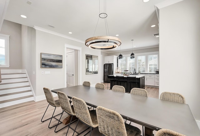 107 Grande Pointe Dr, Inlet Beach, FL 32461 - dining area featuring stairway, light wood-style flooring, recessed lighting, ornamental molding, and baseboards