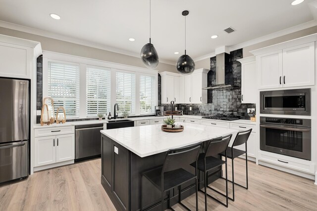 107 Grande Pointe Dr, Inlet Beach, FL 32461 - kitchen with appliances with stainless steel finishes, wall chimney range hood, a sink, decorative backsplash, and white cabinets