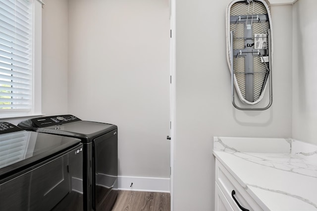 107 Grande Pointe Dr, Inlet Beach, FL 32461 - washroom with separate washer and dryer, cabinet space, and wood finished floors