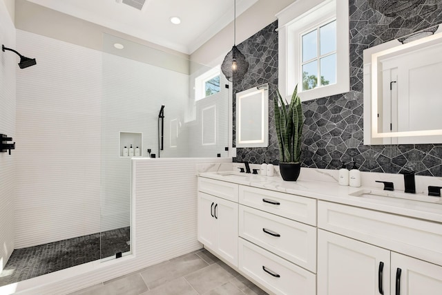107 Grande Pointe Dr, Inlet Beach, FL 32461 - full bathroom featuring double vanity, walk in shower, healthy amount of natural light, tile walls, and tile patterned flooring