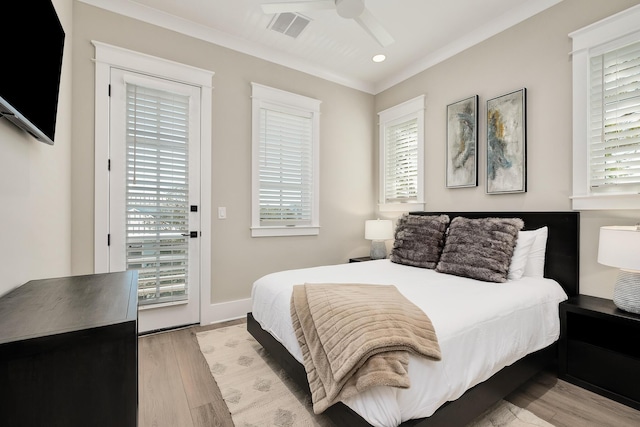 107 Grande Pointe Dr, Inlet Beach, FL 32461 - bedroom with access to exterior, multiple windows, light wood-style flooring, ornamental molding, and recessed lighting