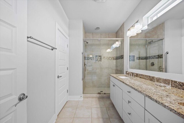 1454 Seaside Cir, Navarre, FL 32566 - bathroom with tile patterned flooring, a stall shower, and vanity