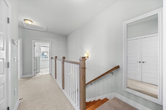 1454 Seaside Cir, Navarre, FL 32566 - stairs featuring carpet floors, attic access, and baseboards