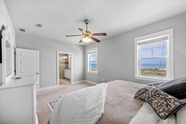1454 Seaside Cir, Navarre, FL 32566 - bedroom with baseboards, ceiling fan, light carpet, and visible vents