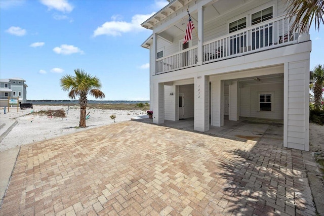 1454 Seaside Cir, Navarre, FL 32566 - view of patio featuring a water view, a view of the beach, and a balcony