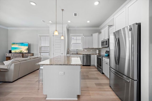 1454 Seaside Cir, Navarre, FL 32566 - kitchen featuring a sink, appliances with stainless steel finishes, crown molding, and open floor plan