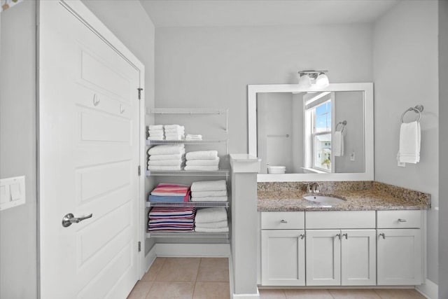 1454 Seaside Cir, Navarre, FL 32566 - bathroom with tile patterned floors, baseboards, and vanity