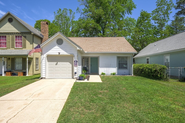2527 Georgetown Ln, Fort Walton Beach, FL 32547 - view of front of house with a chimney, fence, driveway, a front yard, and a garage