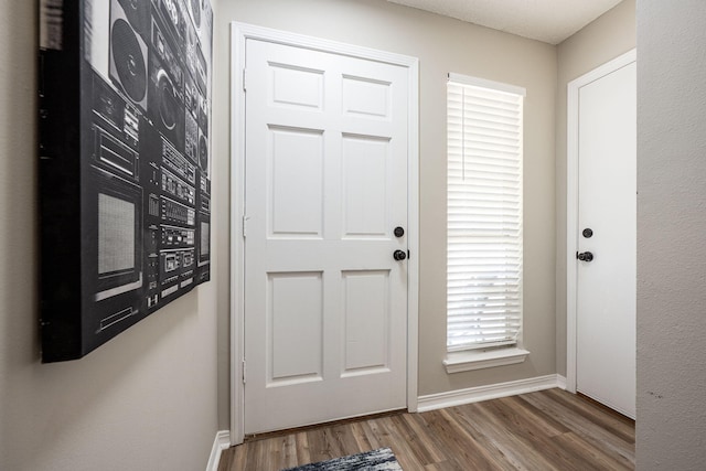2527 Georgetown Ln, Fort Walton Beach, FL 32547 - doorway with baseboards and wood finished floors