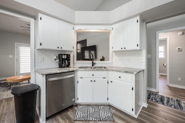 2527 Georgetown Ln, Fort Walton Beach, FL 32547 - kitchen featuring wood finished floors, stainless steel dishwasher, decorative backsplash, and a sink