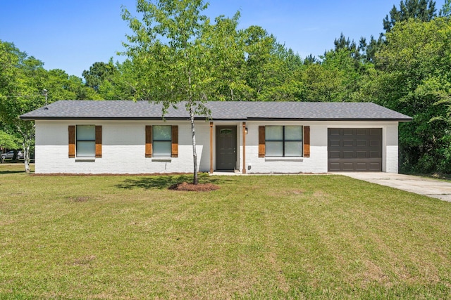 3335 Rolling Hills Cir, Bonifay, FL 32425 - single story home featuring an attached garage, driveway, a front yard, and brick siding