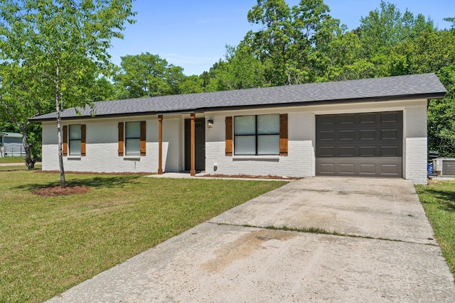 3335 Rolling Hills Cir, Bonifay, FL 32425 - ranch-style house featuring concrete driveway, a front lawn, cooling unit, and an attached garage