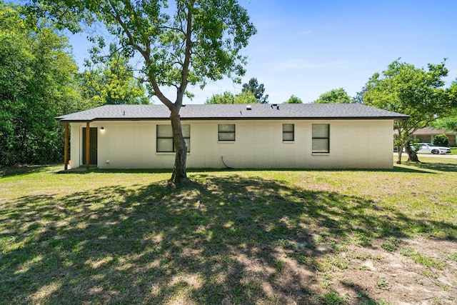 3335 Rolling Hills Cir, Bonifay, FL 32425 - back of house featuring brick siding and a lawn