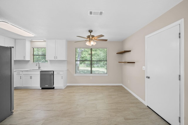 3335 Rolling Hills Cir, Bonifay, FL 32425 - kitchen featuring white cabinetry, appliances with stainless steel finishes, a ceiling fan, and visible vents