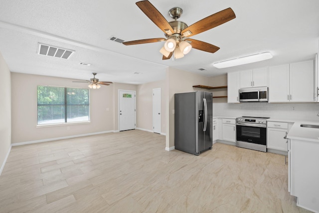 3335 Rolling Hills Cir, Bonifay, FL 32425 - kitchen with light countertops, a ceiling fan, visible vents, appliances with stainless steel finishes, and a sink