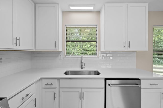 3335 Rolling Hills Cir, Bonifay, FL 32425 - kitchen with a sink, light countertops, stainless steel dishwasher, and white cabinetry