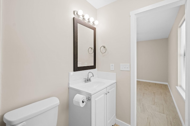 3335 Rolling Hills Cir, Bonifay, FL 32425 - bathroom with toilet, vanity, and baseboards