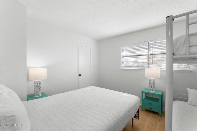bedroom with wood finished floors