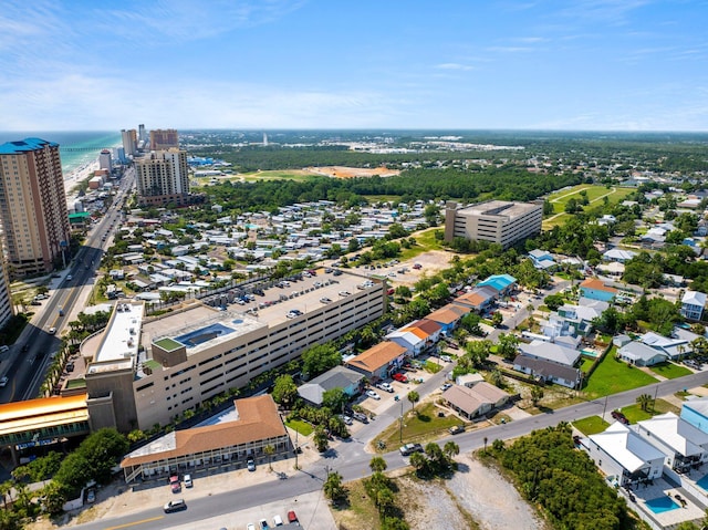 drone / aerial view featuring a water view and a view of city