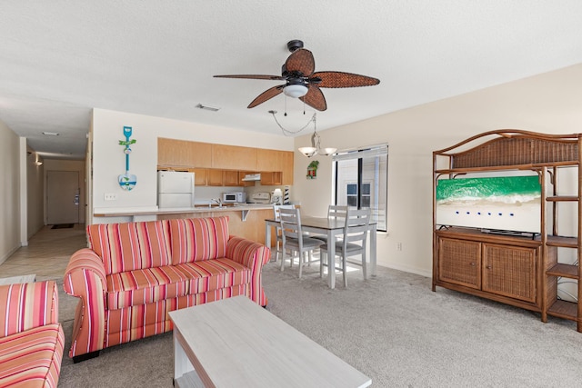 468 Abalone Ct Unit 31, Fort Walton Beach, FL 32548 - living room with visible vents, a ceiling fan, baseboards, and light carpet