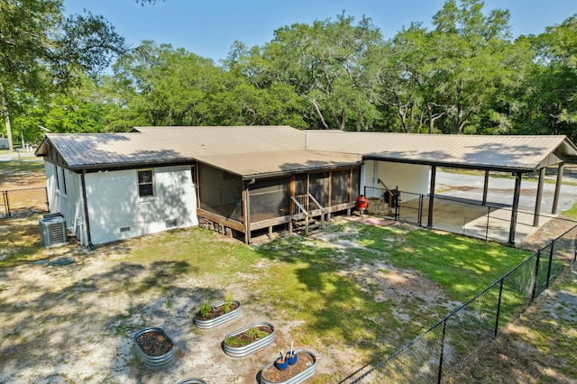 1259 Black Creek Blvd, Freeport, FL 32439 - back of property featuring a sunroom, metal roof, cooling unit, crawl space, and view of scattered trees