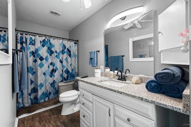 1259 Black Creek Blvd, Freeport, FL 32439 - bathroom with a ceiling fan, vanity, wood finished floors, and toilet