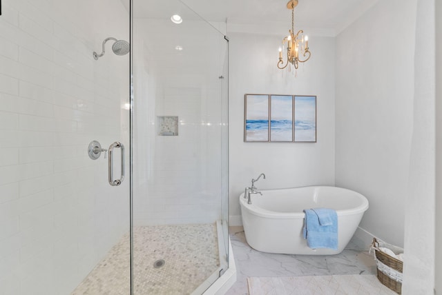 205 Mallard Ln, Santa Rosa Beach, FL 32459 - bathroom with a freestanding bath, marble finish floor, a stall shower, and an inviting chandelier