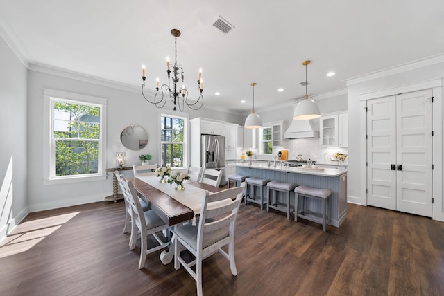 205 Mallard Ln, Santa Rosa Beach, FL 32459 - dining area featuring dark wood-type flooring, visible vents, an inviting chandelier, and recessed lighting