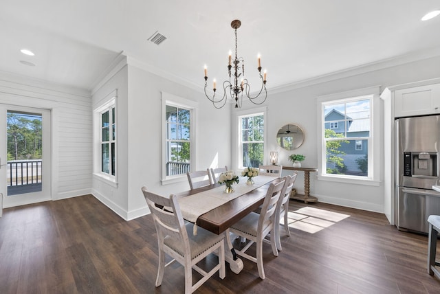 205 Mallard Ln, Santa Rosa Beach, FL 32459 - dining room featuring an inviting chandelier, crown molding, dark wood-type flooring, and baseboards