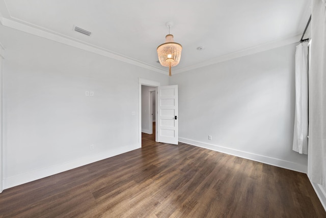 205 Mallard Ln, Santa Rosa Beach, FL 32459 - spare room featuring dark wood finished floors, baseboards, crown molding, and visible vents