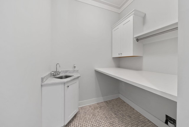 205 Mallard Ln, Santa Rosa Beach, FL 32459 - laundry room with light floors, baseboards, indoor wet bar, and a sink