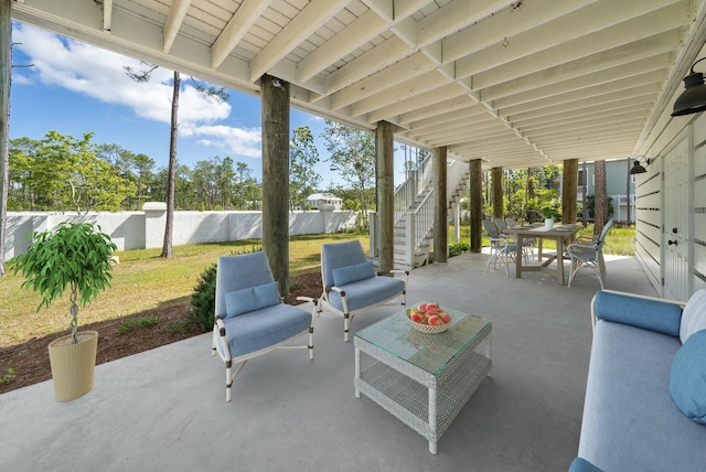 205 Mallard Ln, Santa Rosa Beach, FL 32459 - view of patio / terrace with a fenced backyard, stairway, an outdoor living space, and outdoor dining area