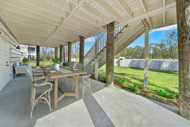 205 Mallard Ln, Santa Rosa Beach, FL 32459 - view of patio / terrace featuring stairway, fence, and outdoor dining area