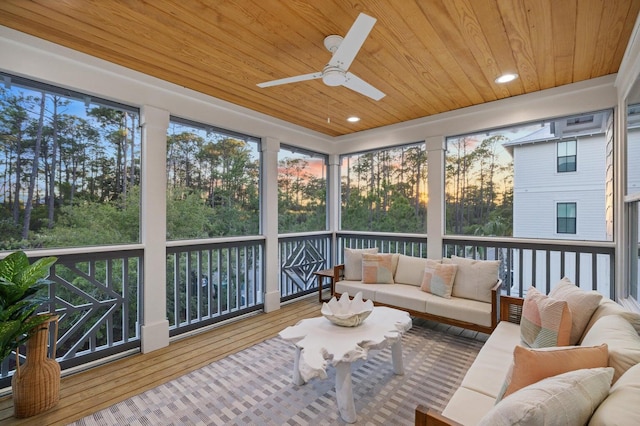 sunroom / solarium featuring a ceiling fan and an outdoor hangout area