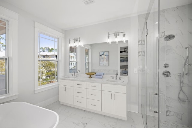 bathroom with a soaking tub, a sink, visible vents, a marble finish shower, and marble finish floor
