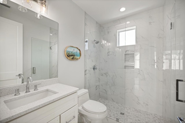 full bath featuring recessed lighting, a marble finish shower, toilet, and vanity