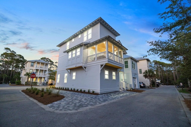 view of side of home with a balcony