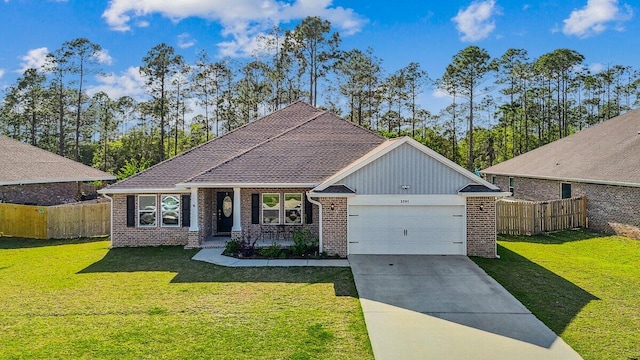 3291 Secret Isle Way, Navarre, FL 32566 - view of front of house with brick siding, an attached garage, and concrete driveway