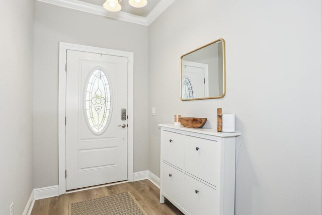 3291 Secret Isle Way, Navarre, FL 32566 - foyer featuring baseboards, light wood finished floors, and ornamental molding