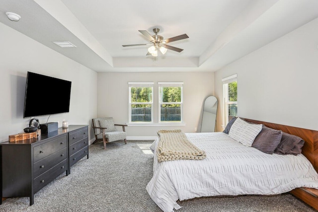 3291 Secret Isle Way, Navarre, FL 32566 - bedroom featuring a raised ceiling, multiple windows, carpet, and ceiling fan