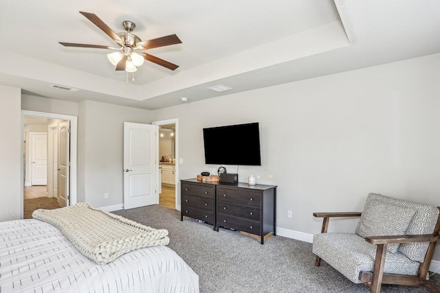 3291 Secret Isle Way, Navarre, FL 32566 - carpeted bedroom with a tray ceiling, baseboards, and a ceiling fan