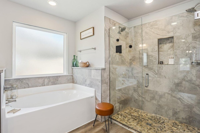 3291 Secret Isle Way, Navarre, FL 32566 - full bath with a bath, a stall shower, wood finished floors, and recessed lighting