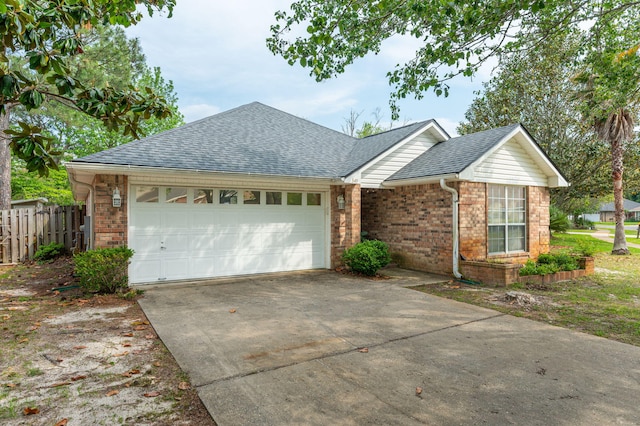 ranch-style home featuring brick siding, roof with shingles, a garage, and driveway