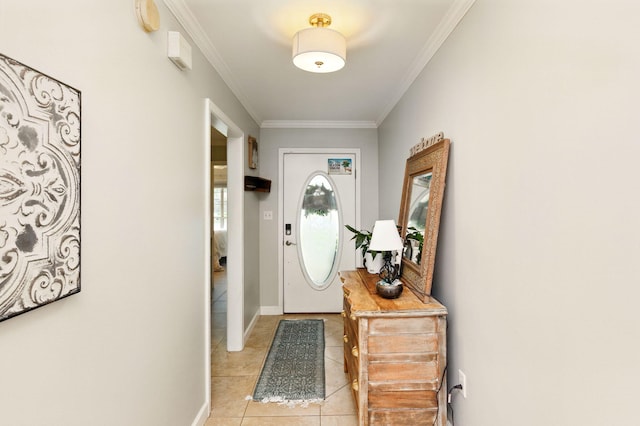entrance foyer featuring baseboards, ornamental molding, and light tile patterned floors