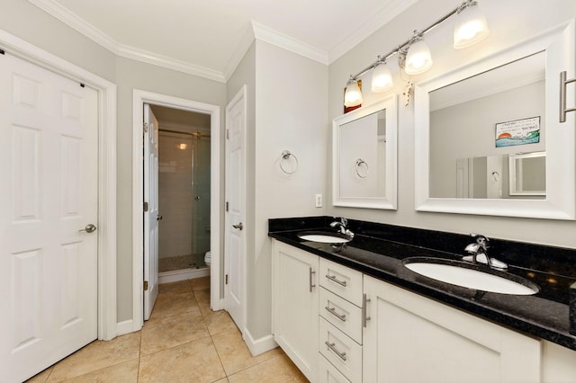 full bath with ornamental molding, tile patterned flooring, a sink, and double vanity
