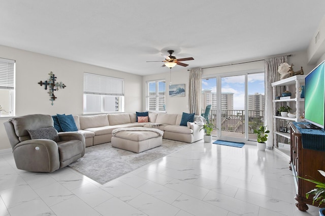 122 Seascape Dr Unit 701, Miramar Beach, FL 32550 - living room with ceiling fan and marble finish floor