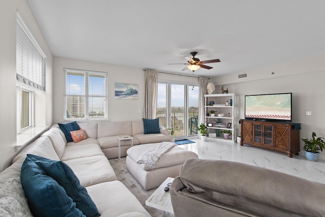 122 Seascape Dr Unit 701, Miramar Beach, FL 32550 - living room featuring plenty of natural light, visible vents, marble finish floor, and ceiling fan