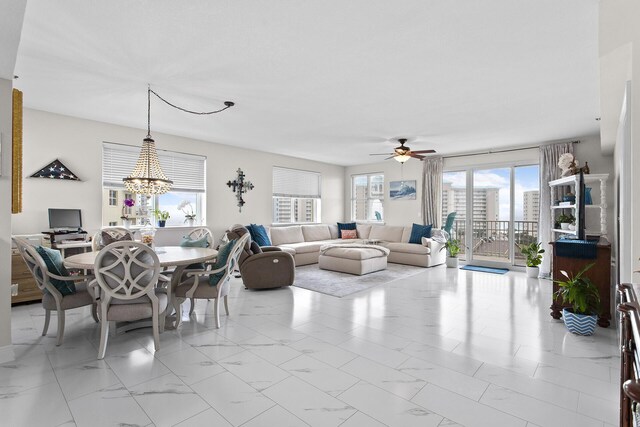 122 Seascape Dr Unit 701, Miramar Beach, FL 32550 - dining space with ceiling fan with notable chandelier and marble finish floor